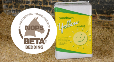 Sundown Yellow bale of bedding with the BETA NOPS logo next to it