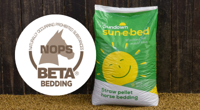 Sundown Sun-e-bed bag of bedding with the BETA NOPS logo next to it