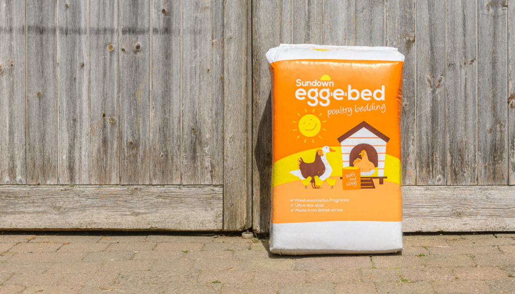 Egg-e-bed bale outside a wooden door