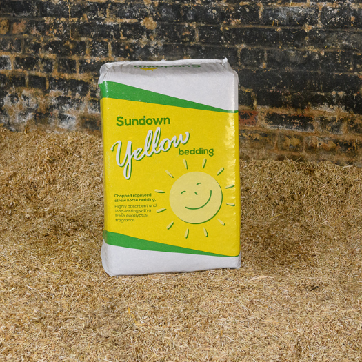 bale of Sundown Yellow bedding on a chopped straw bed