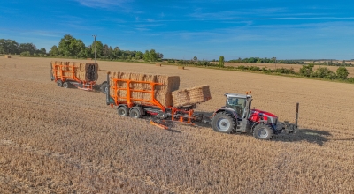 Bales of straw being loaded onto a trailer