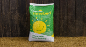 Sun-e-bed bag sitting on a layer of pellets